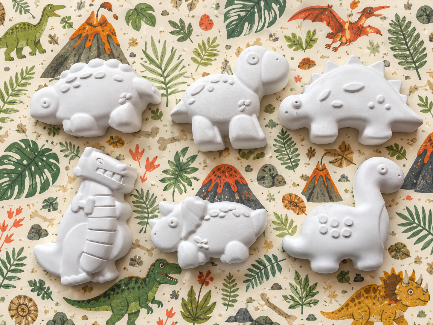 Six unpainted dinosaur art designs
